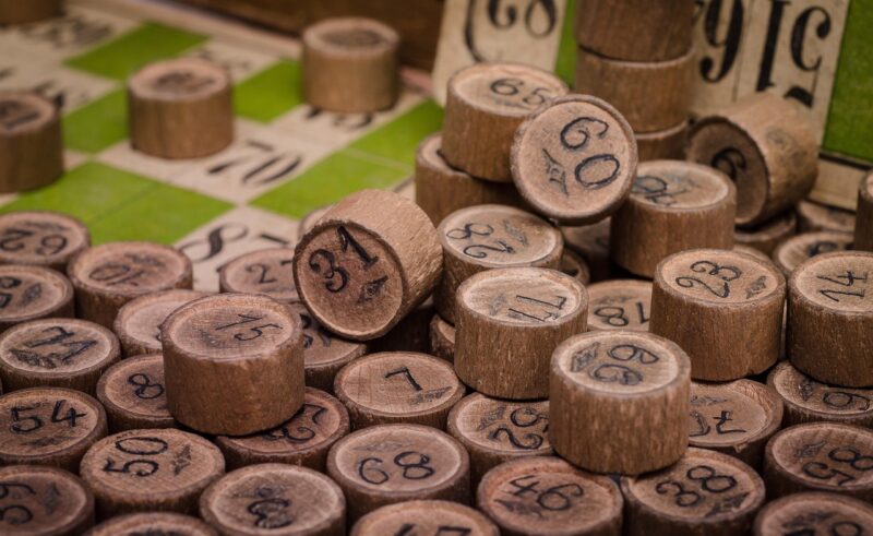 Old wooden bingo chips in a